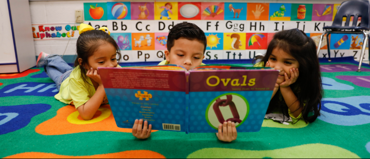 texas-sped-hero-image_0.png Students reading a book together